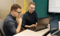 Colleagues working together in a conference room.