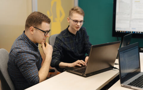 Colleagues working together in a conference room.