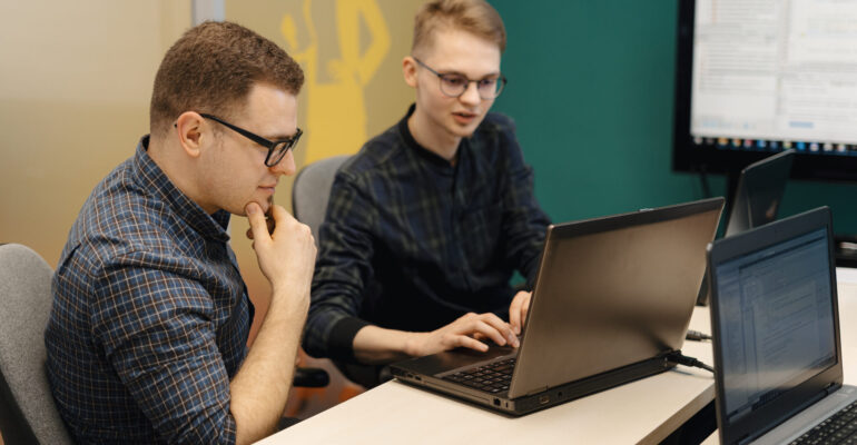 Colleagues working together in a conference room.