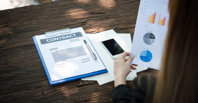 business woman working with documents graphs ,analyzing investm