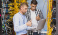 young-network-engineers-with-laptop-medium-shot